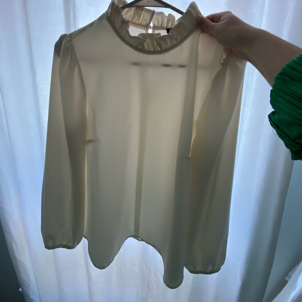 J Crew cream ruffled neck blouse